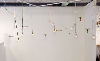 A collection of jewellery-like pendant lamps by the Montreal-based designer Jean-Pascal Gauthier, at Sight Unseen Offsite.