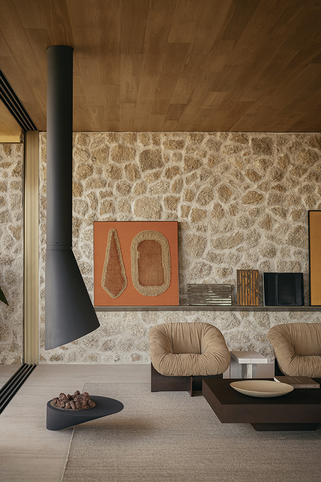 Bravissima House by Arthur Casas, a brazilian house nestled among the forest canopy and rising above the foliage to long views from large windows and ample terraces