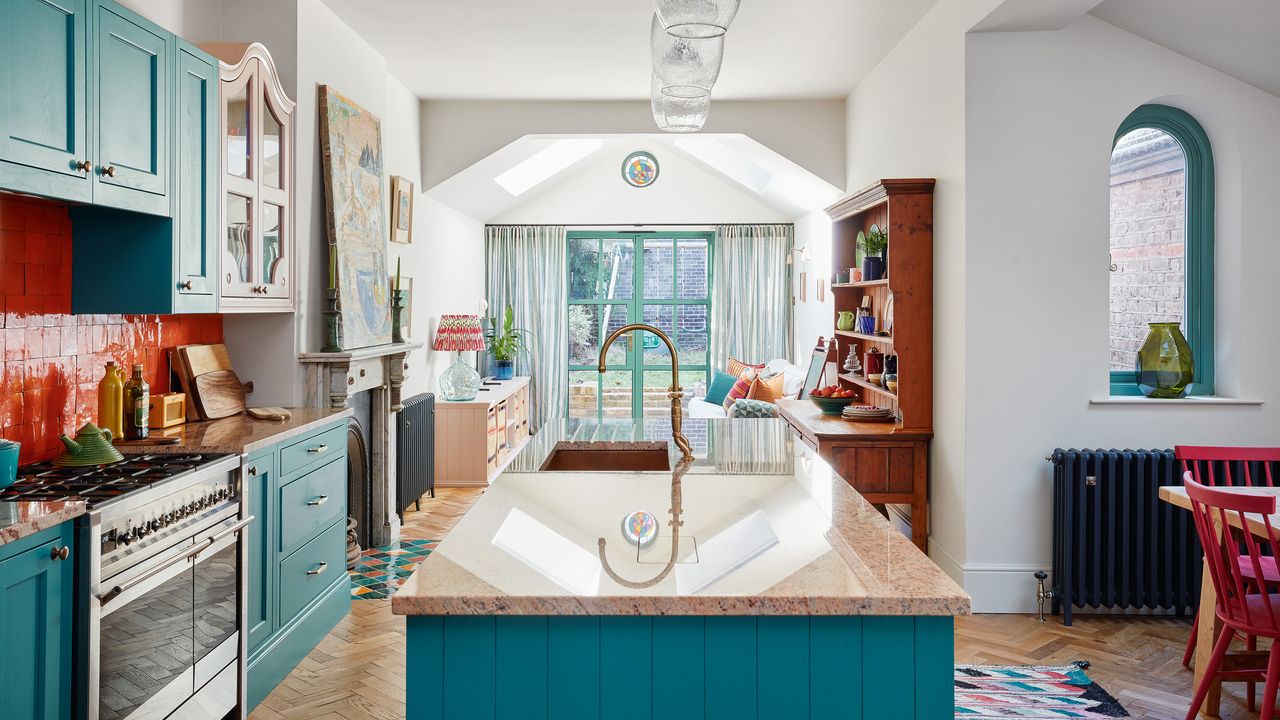 open plan kitchen diner with a vew into the back garden packed with colour and pattern