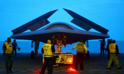 An X-47B Unmanned Combat Air System on the aircraft carrier USS George H.W. Bush in May. The Navy plans to have unmanned aircraft on each of its carriers to be used for surveillance and be ar