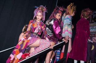 Fashion model with colorful dreadlocks hair