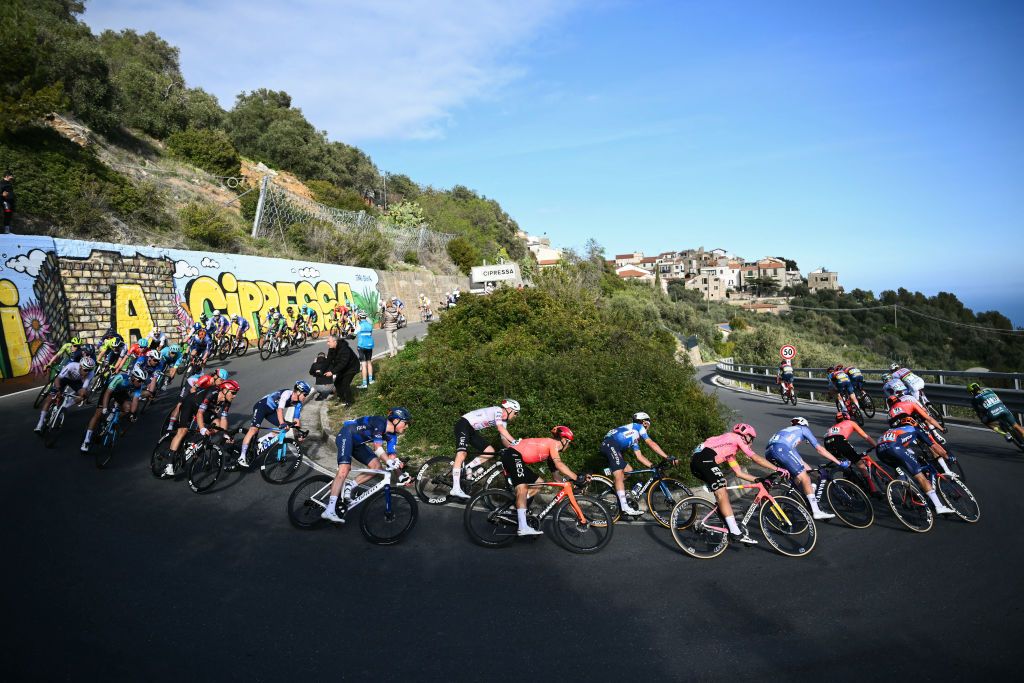 Soudal Quick&acirc;Step's French rider Julian Alaphilippe (C) rides through the Cipressa with the pack during the 115th Milan-SanRemo one-day classic cycling race, between Pavia and SanRemo, on March 16, 2024. (Photo by Marco BERTORELLO / AFP)