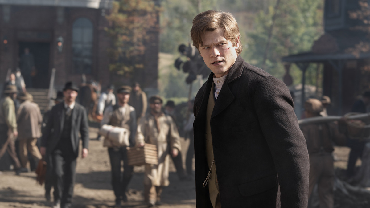 Garret Van Ness (Lucas Till) stands in a busy street in Netflix&#039;s &amp;quot;The Abandons&amp;quot;