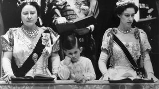 Queen Elizabeth Queen Mother and Prince Charles with Princess Margaret Rose (1930 - 2002) in the royal box at Westminster Abbey watching the coronation ceremony of Queen Elizabeth II.