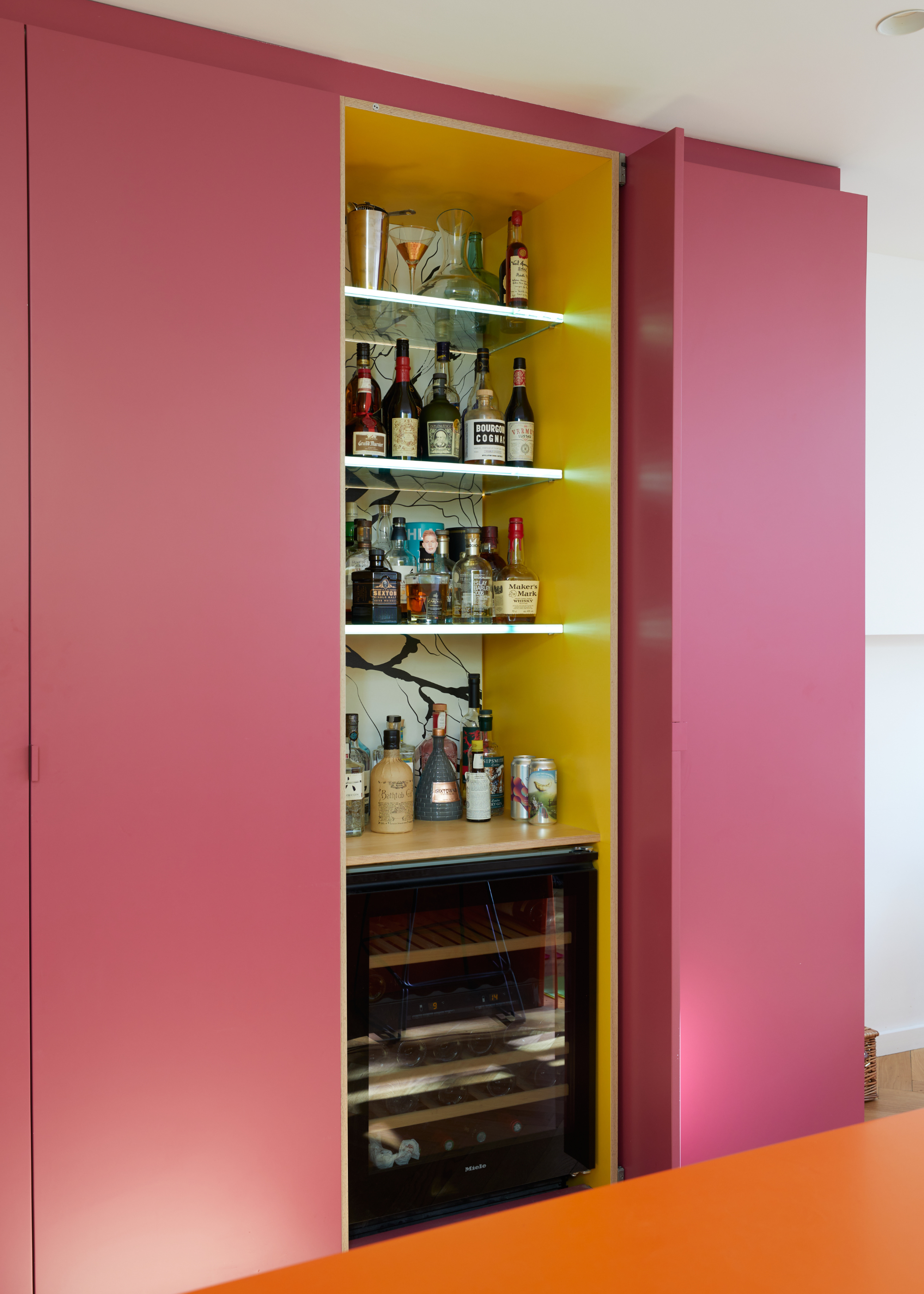 pink HIMAC kitchen cabinets with a bar within