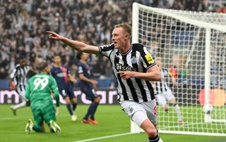 Newcastle player Sean Longstaff celebrates after scoring the third goal during the UEFA Champions League match between Newcastle United FC and Paris Saint-Germain at St. James Park on October 04, 2023 in Newcastle upon Tyne, England. 
