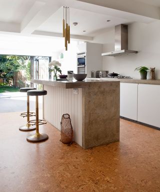 A modern kitchen with natural cork flooring