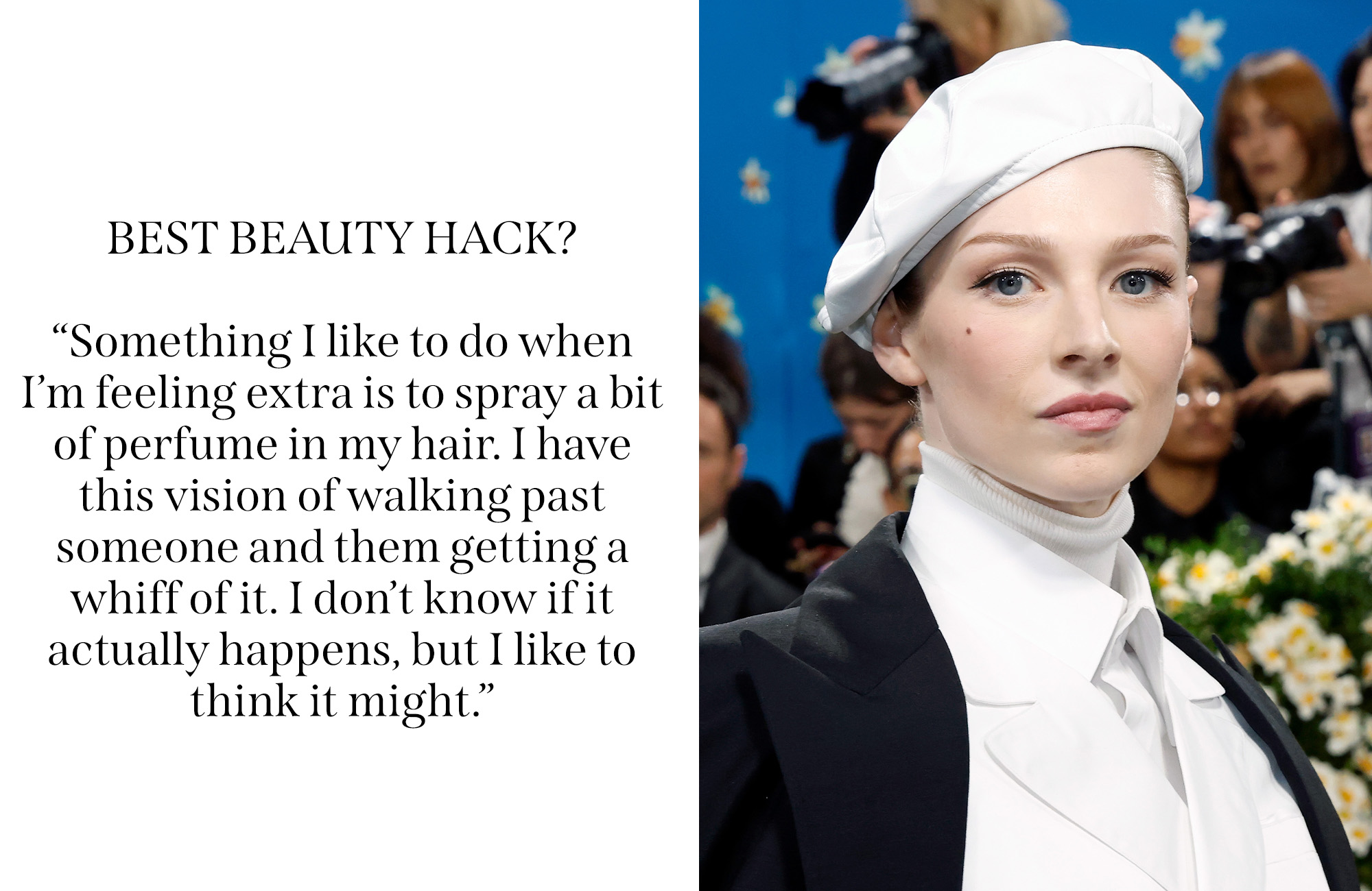 Hunter Schafer on the red carpet in a white suit and a matching white hat