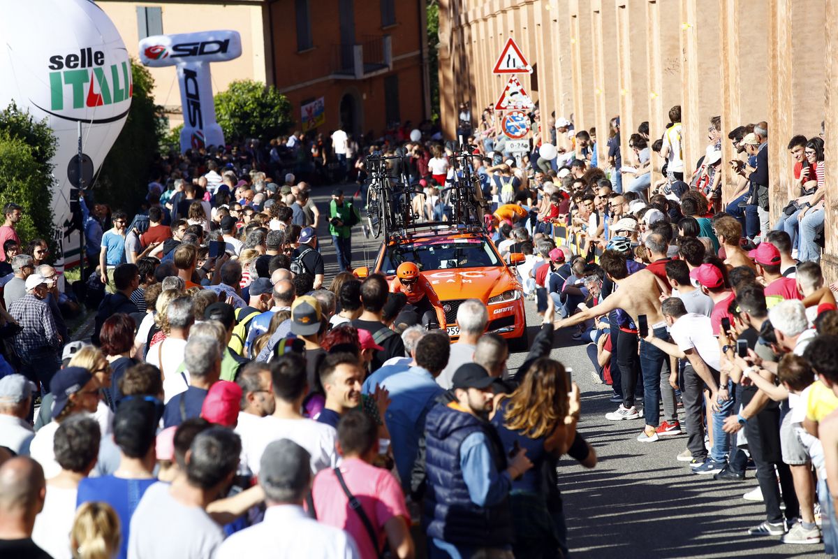 A CCC rider barely visible through the massed crowds