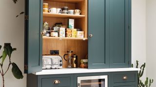 freestanding kitchen pantry with concealed kettle station