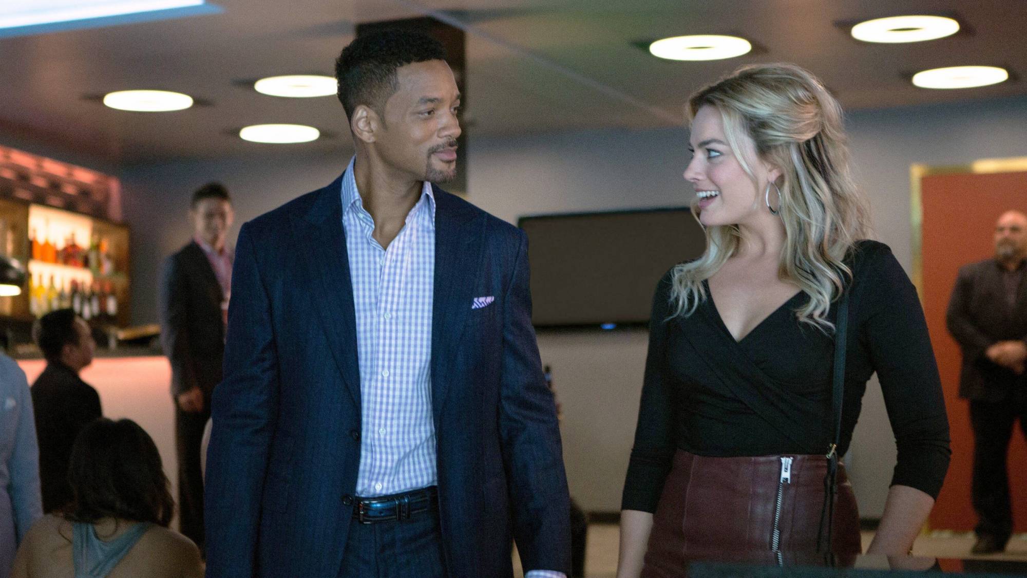 (L-R) Will Smith as Nicky Spurgeon and Margot Robbie as Jess Barrett in "Focus"