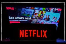 Netflix logo on smart phone in front of TV screen showing a Netflix menu screen