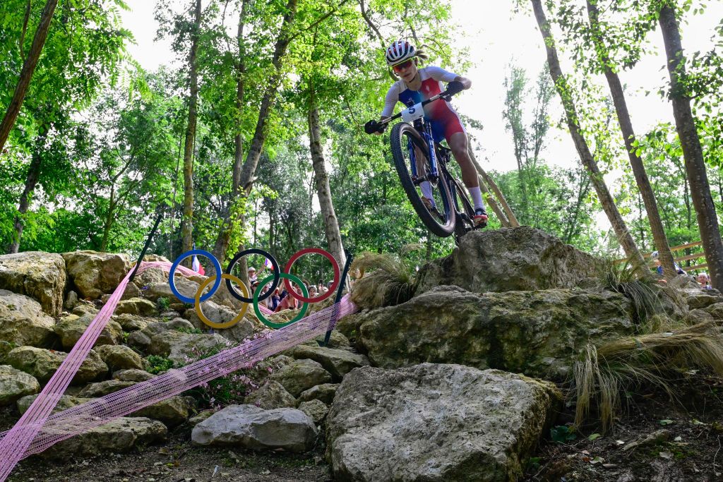 France's Loana Lecomte competes in the women's cross-country mountain biking event during the Paris 2024 Olympic Games in Elancourt Hill venue in Elancourt, on July 28, 2024. (Photo by John MACDOUGALL / AFP)