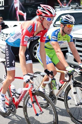 Andy Schleck (Saxo Bank) and Franchesco Chicchi (Liquigas) roll out towards the start line.