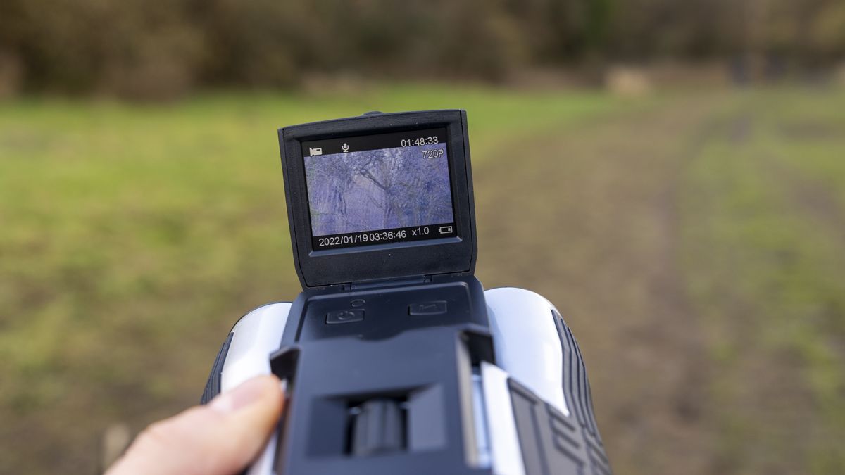 Camonity 12 x 32 digital binoculars in a ladies hand