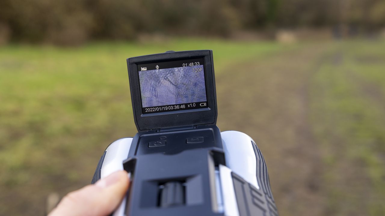Camonity 12 x 32 digital binoculars in a ladies hand