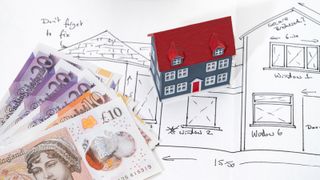 drawing of house with model of house and &pound;20 and &pound;10 notes lying on top of drawing