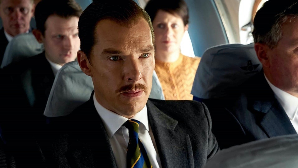 A still from The Courier showing Benedict Cumberbatch's character Greville Wynne traveling on a plane.