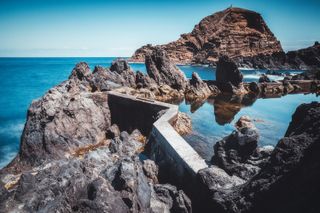 A natural pool with the Atlantic Ocean in the background in Porto Moniz, Madeira