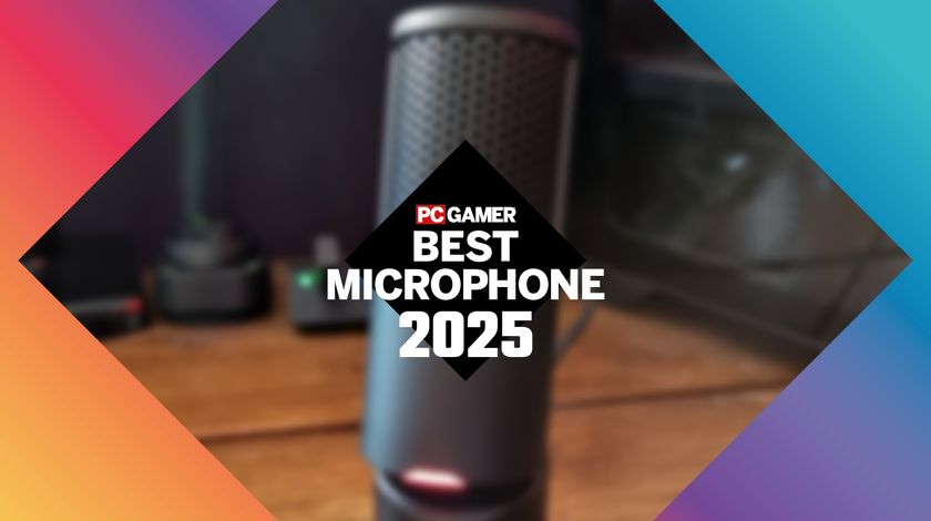A HyperX SoloCast 2 gaming microphone, blurred, behind the PC Gamer Best Microphone 2025 logo