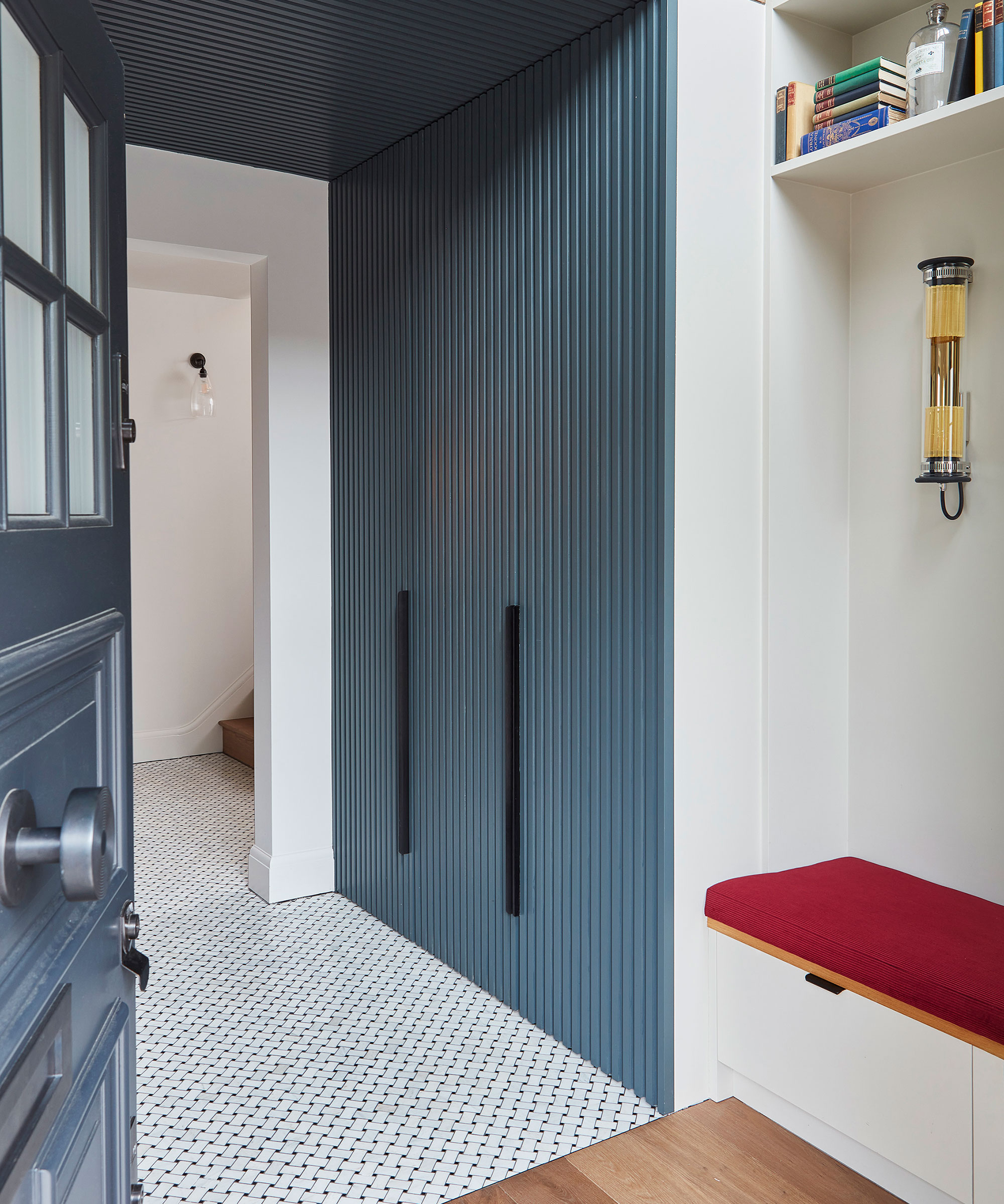 entrance hallway with modern built-in storage and storage bench