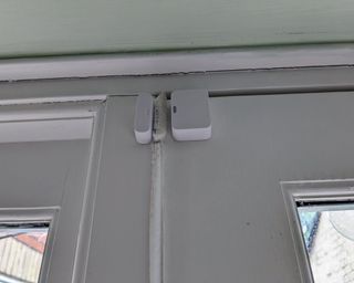 Simplisafe contact sensor installed on door in writer's home