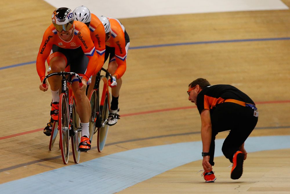 The Dutch coach gets into the action as the team sprinters go past.
