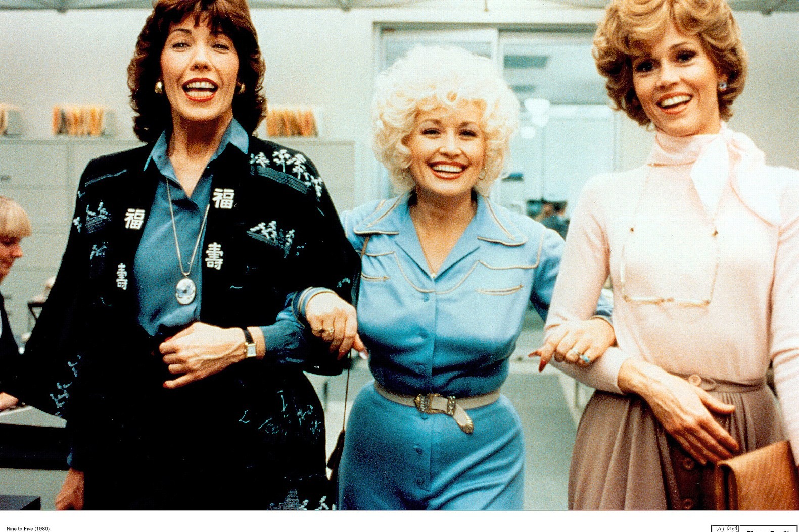 Lily Tomlinson, Dolly Parton, and Jane Fonda walking through an office in '9 to 5'