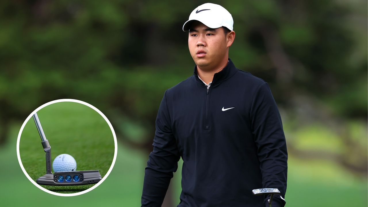 Tom Kim walks off the green with a putter in his hand