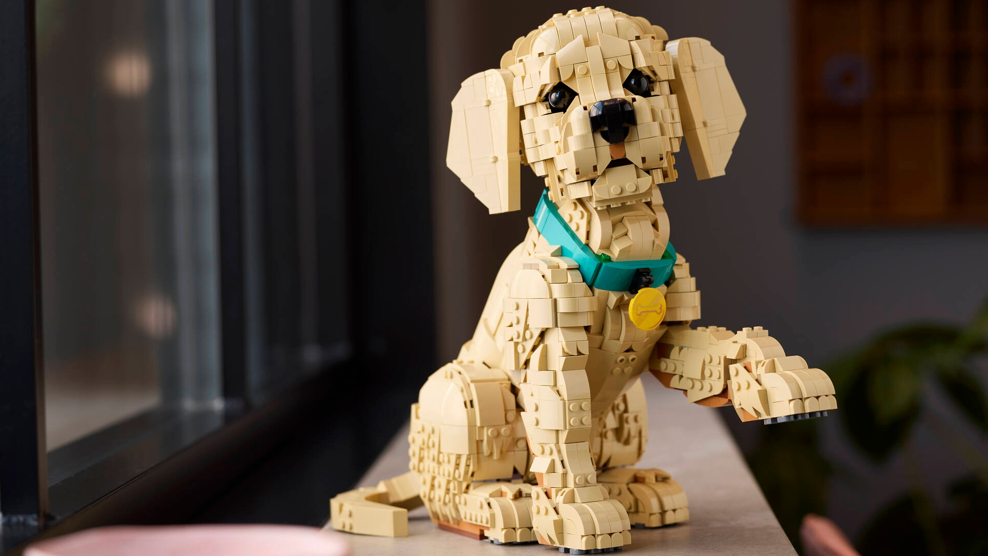 Lego Golden Retriever Puppy on a side mantle lifting its paw