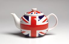 Close up of a union jack patterned teapot on white background