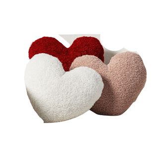 Three faux fur heart shaped pillows