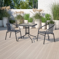 Winston Porter Berthenia 28'' Square Glass Metal Table with Rattan Edging and 2 Rattan Stack Chairs | Was $693 Now $129.99 at Wayfair