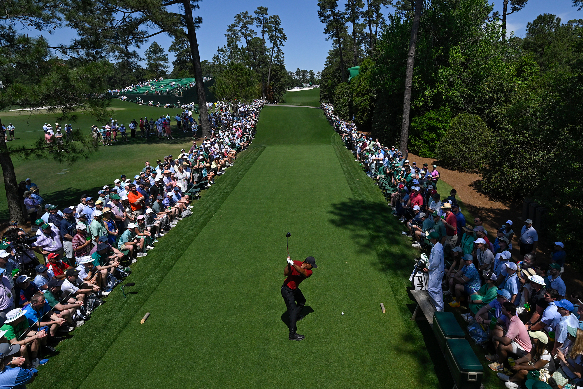 Tiger Woods hitting a tee shot at The Masters in 2024