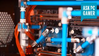 Liquid-cooled PC interior with blue liquid in pipes