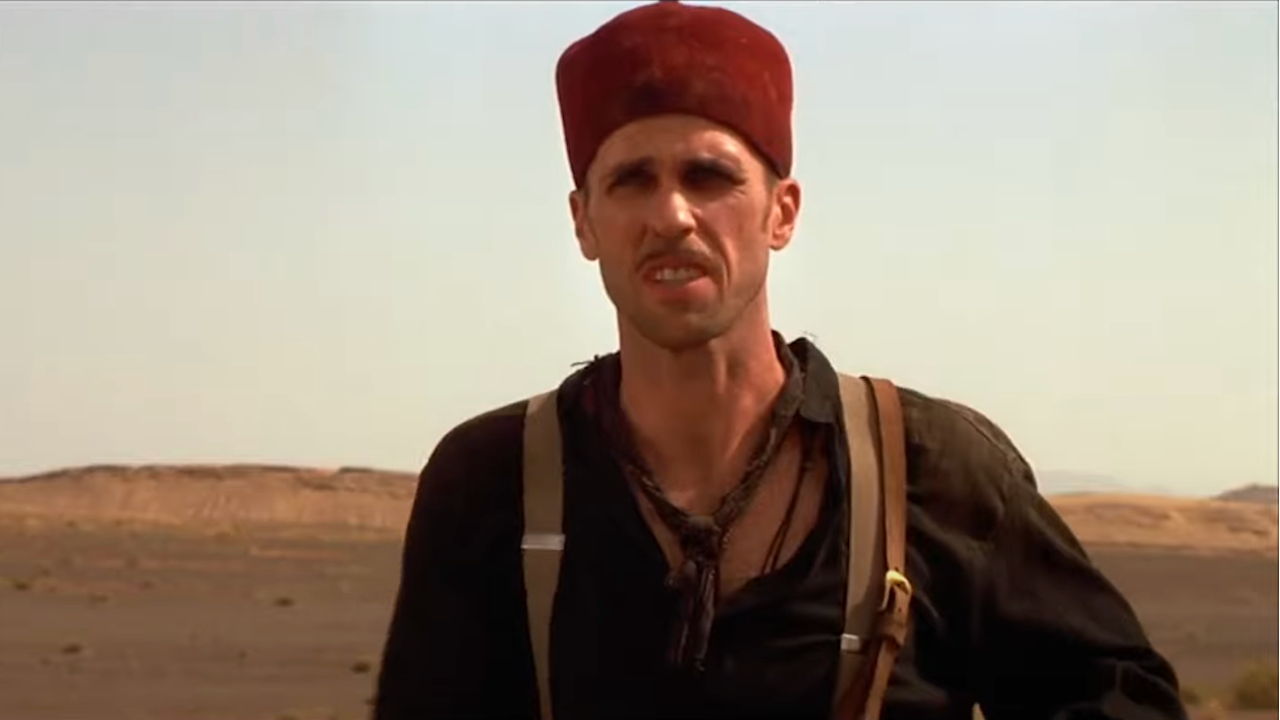 Kevin J O'Connor stands in the middle of the desert in mid conversation in The Mummy.