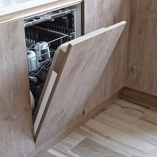 dish washer with wooden cabinet