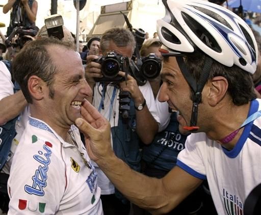 Friends and collaborators. The widely popular Ballerini has some fun with Paolo Bettini after the latter claimed Olympic gold in Athens, 2004
