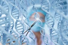 Doctor looking at strands of DNA.