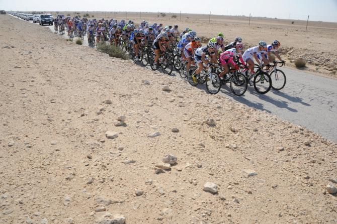 The peloton highlights the dreary desert surrounds in Qatar