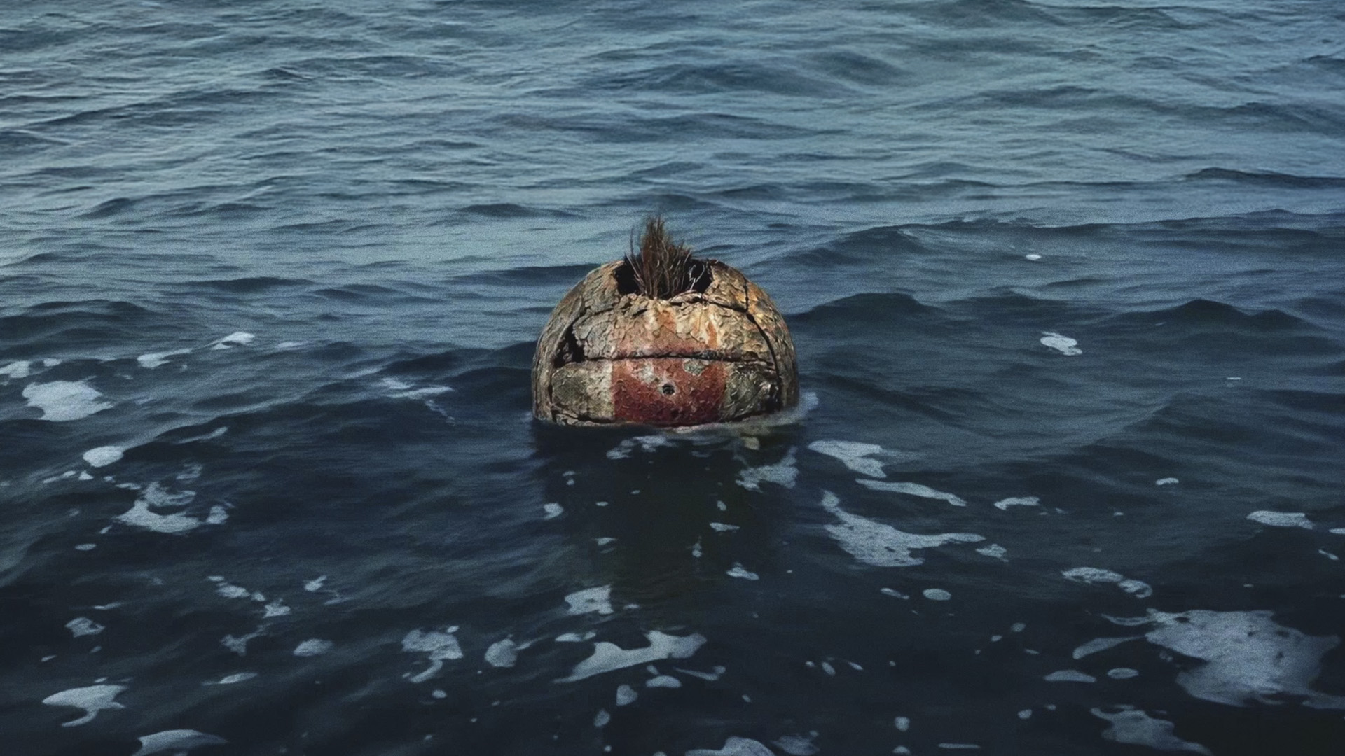 A degraded Wilson the volleyball from Cast Away lost at sea
