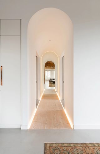 a hallway with recessed led lighting