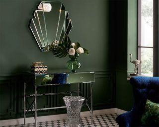 John Lewis shell mirror with green wall paint decor, mirrored hallway table, green vase and blue velvet chair