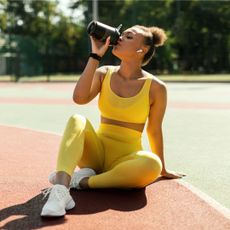 Creatine benefits: A woman drinking a shake