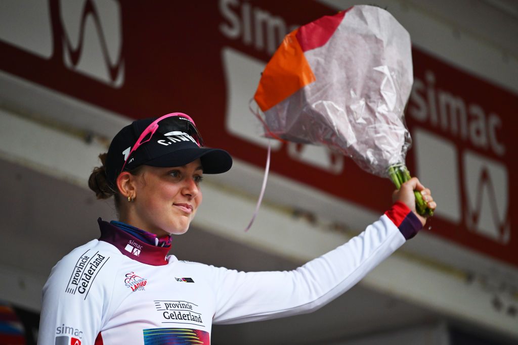 ASSEN NETHERLANDS OCTOBER 09 Zoe Backstedt of The United Kingdom and Team CanyonSRAM Racing celebrates at podium as White best young jersey winner during the 26th Simac Ladies Tour 2024 Stage 2 a 1548km stage from Coevorden to Assen on October 09 2024 in Assen Netherlands Photo by Luc ClaessenGetty Images