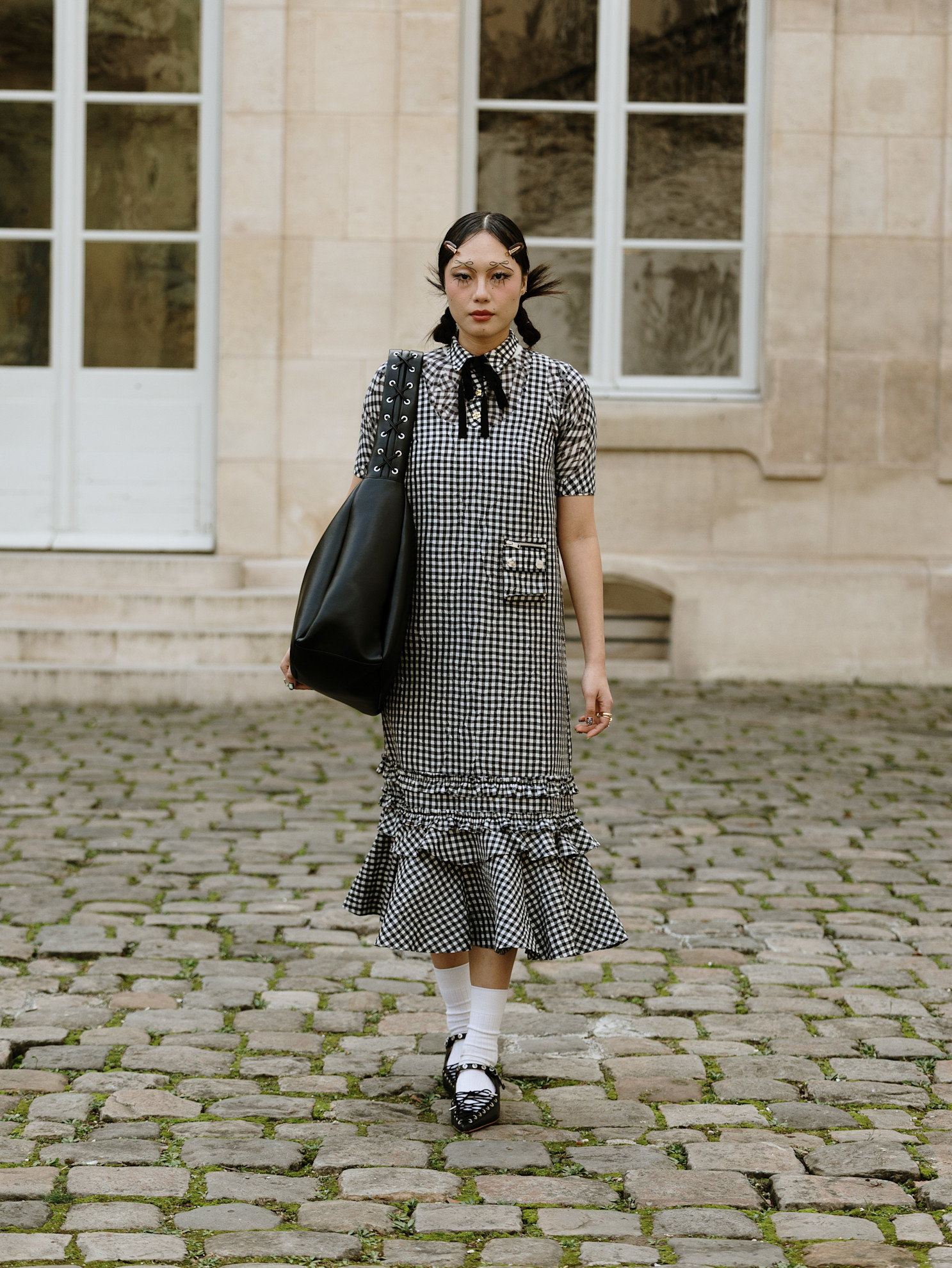 woman wearing a checkered dress in paris.