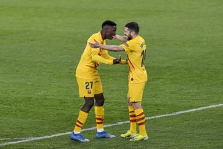 Barcelona's Ilaix Moriba (left) celebrates with his team-mate Lionel Messi after scoring