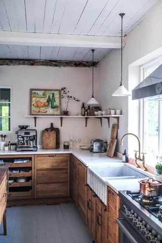 rustic wood kitchen with artwork by deVOL
