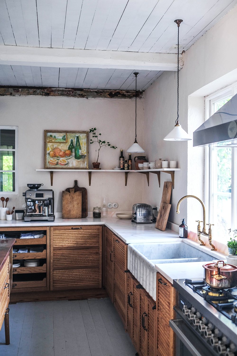 rustic wood kitchen with artwork by deVOL