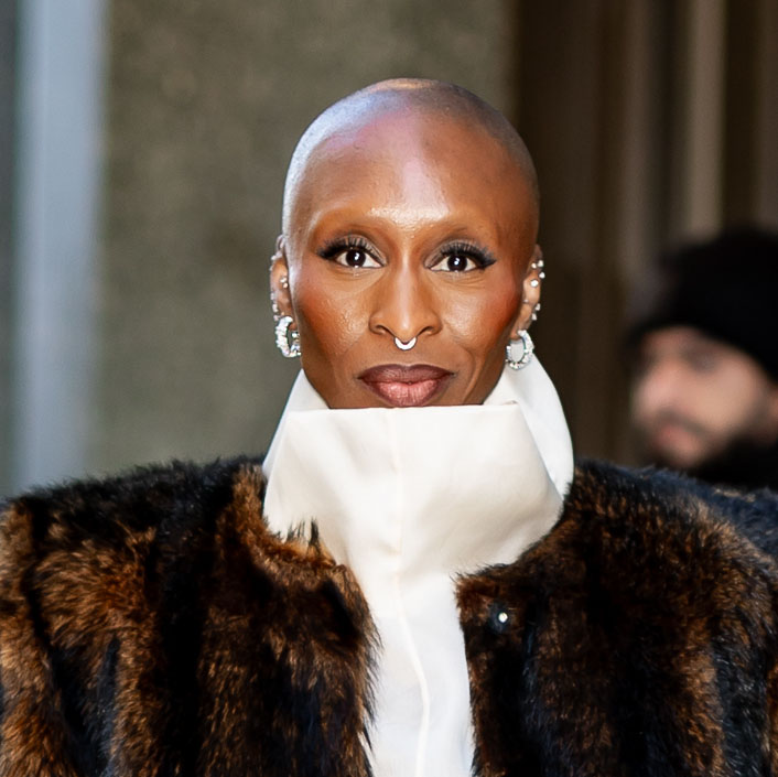 Cynthia Erivo wearing a fur coat and black boots